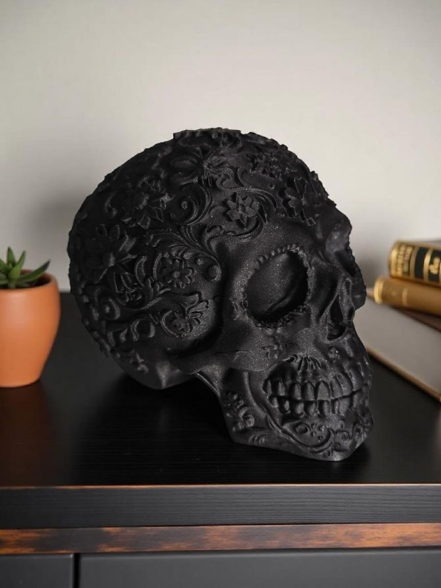 Glossy Black Decorative Skull Statue – Floral Engraved Gothic Skeleton