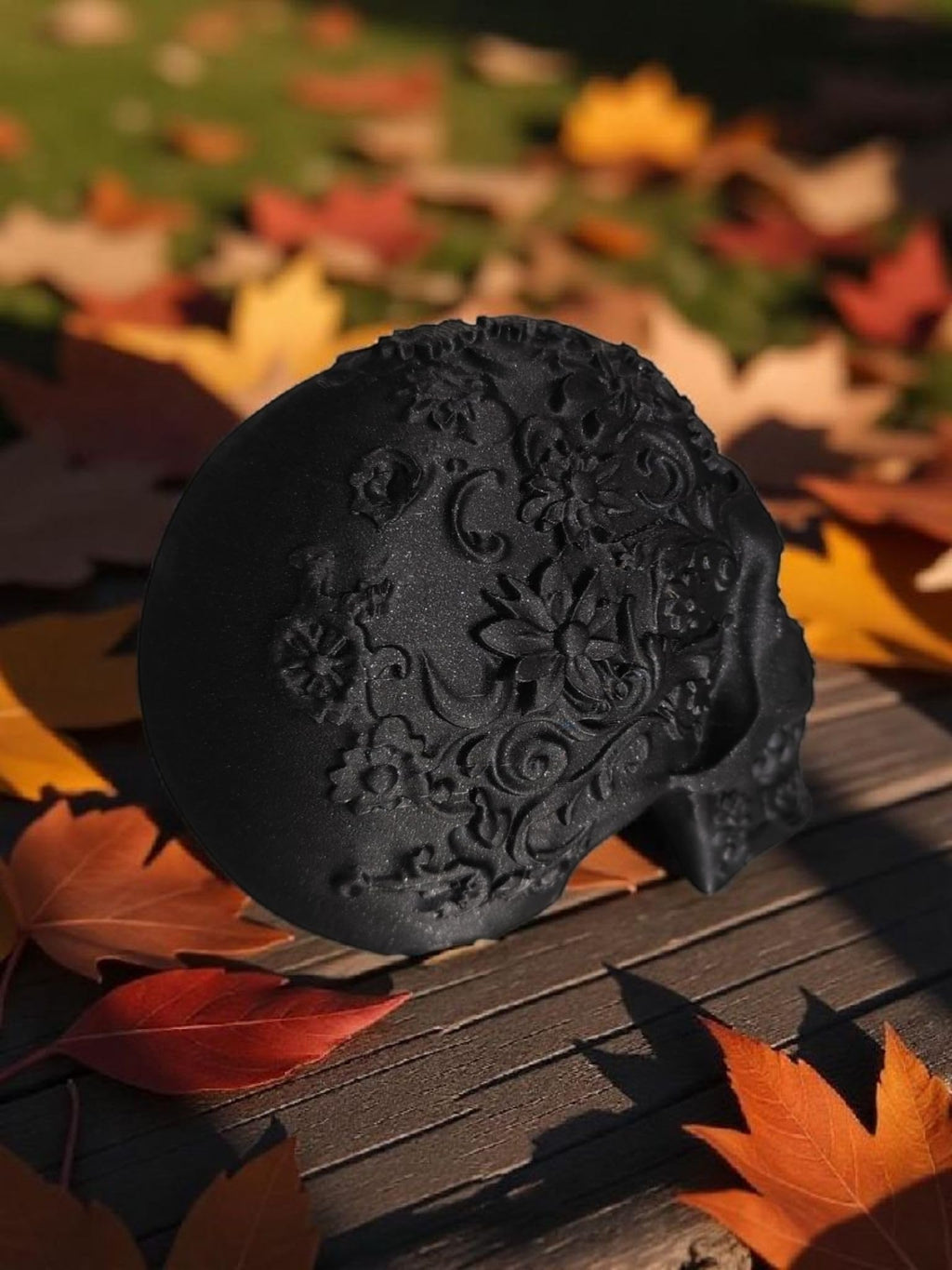 Glossy Black Decorative Skull Statue – Floral Engraved Gothic Skeleton